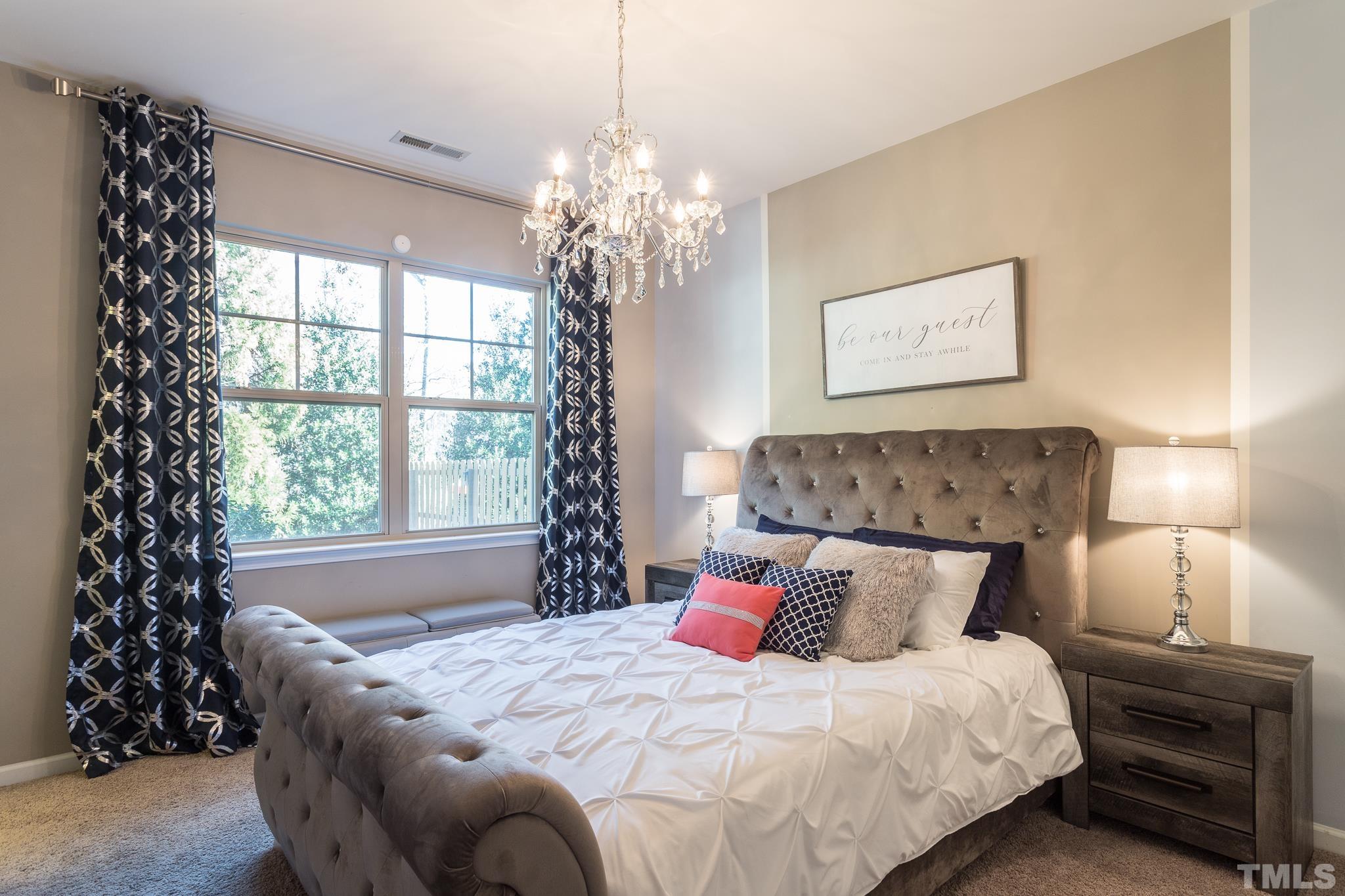 826 Wickham Ridge Road Apex, NC 27539 - Photo 20 of 47 a bedroom with bed and window