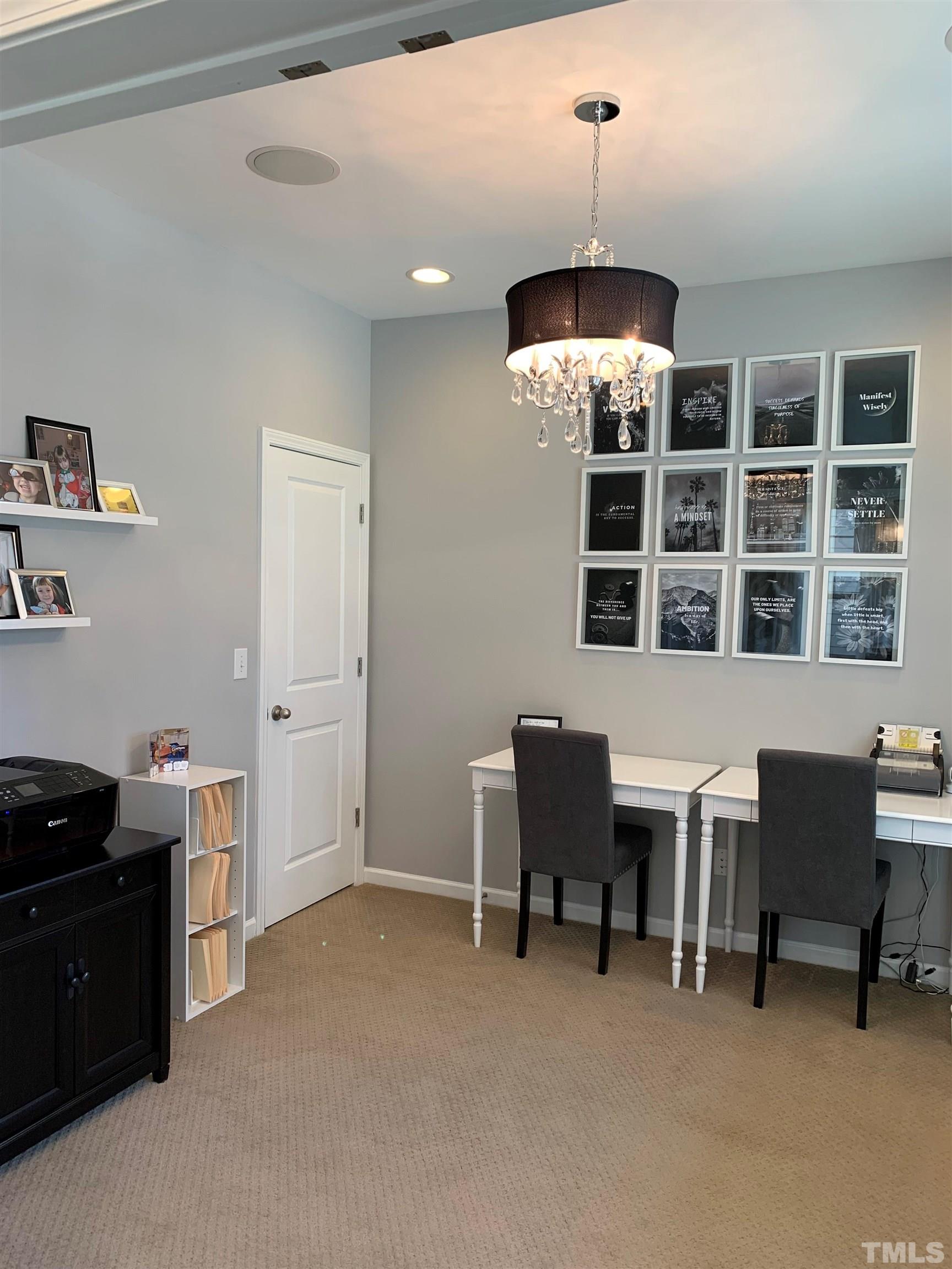 826 Wickham Ridge Road Apex, NC 27539 - Photo 4 of 47 a dining room with furniture and chandelier