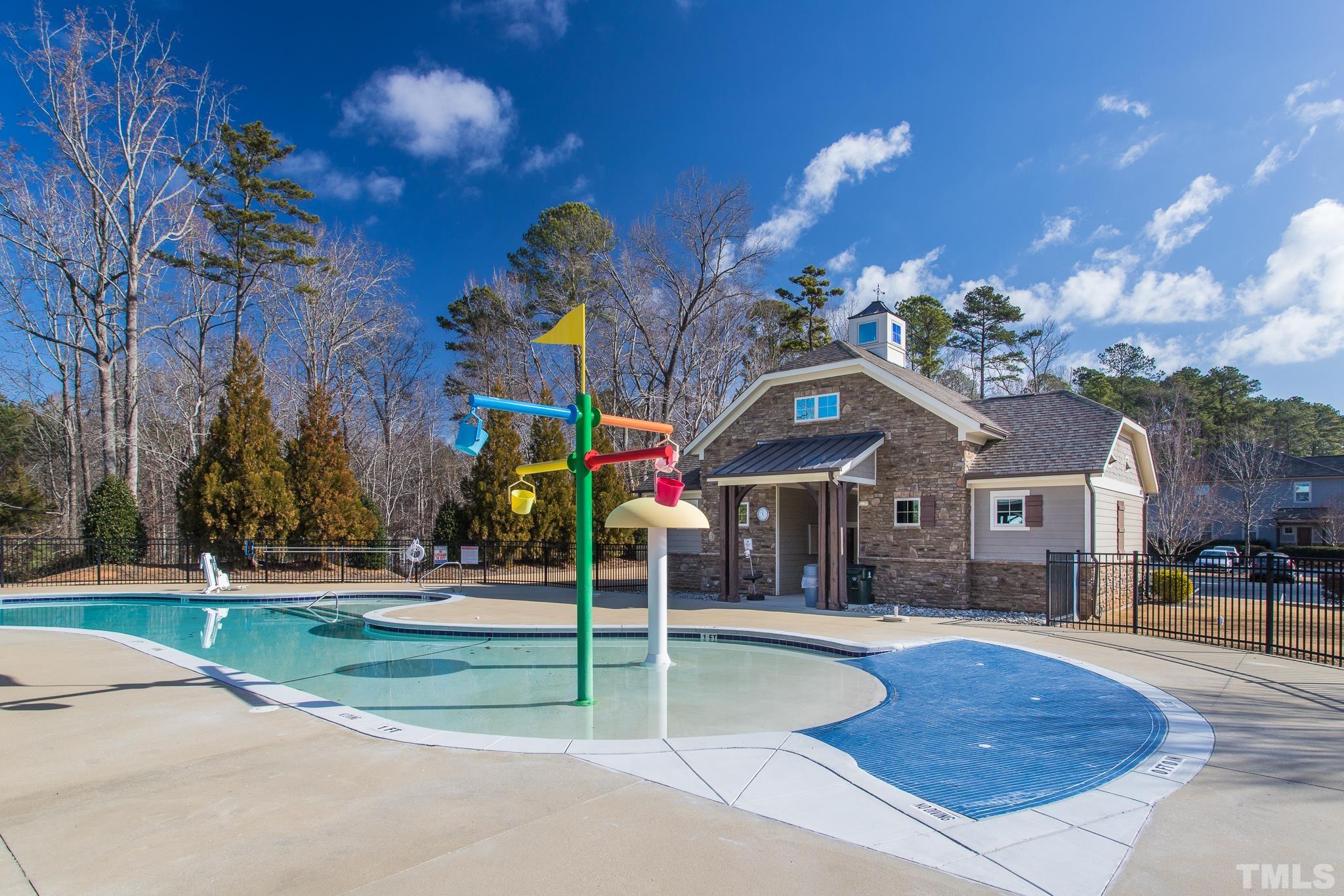 826 Wickham Ridge Road Apex, NC 27539 - Photo 45 of 47 a view of a house with a swimming pool