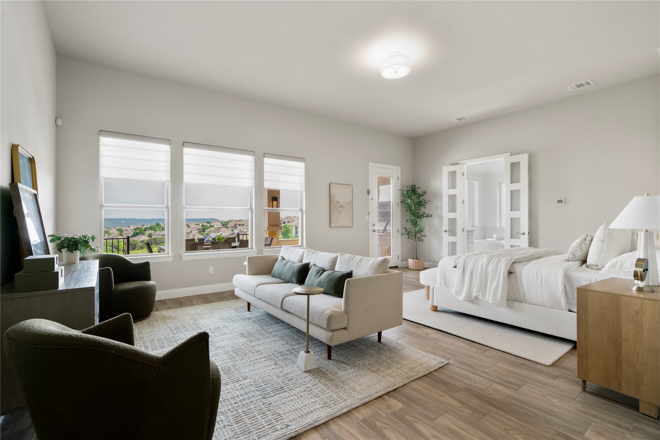 2033 Portobello Road Leander, TX 78641 - Photo 19 of 39 The owner's suite was extended upon initial construction to create space for a living area. Wake up to serenity with expansive windows and spectacular views.
