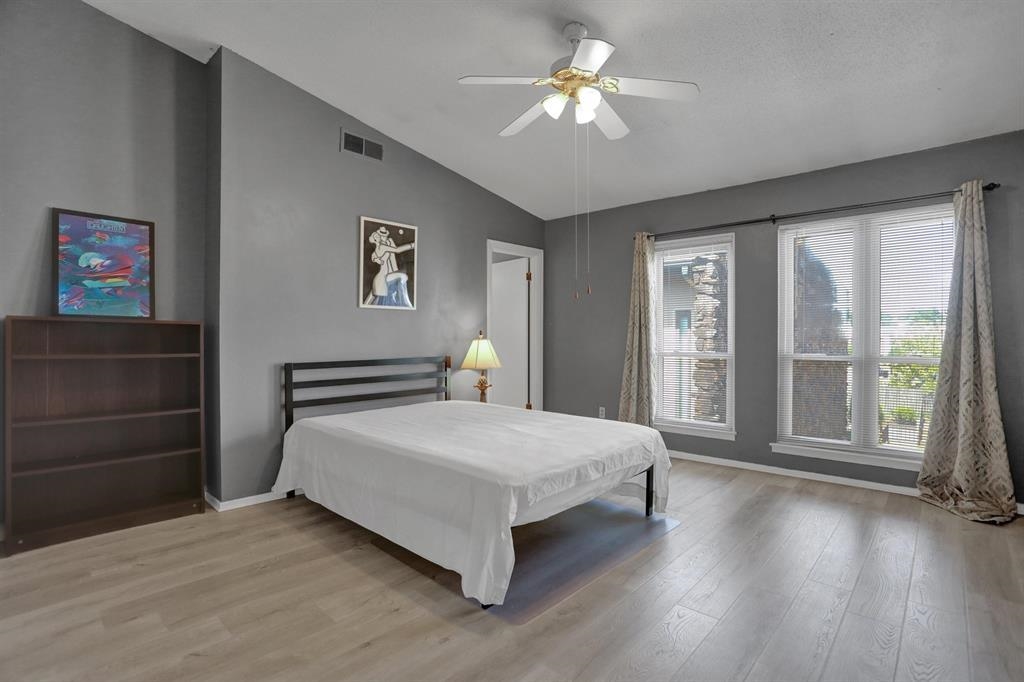 433 South Perkins Road, Unit 433 Memphis, TN 38117 - Photo 12 of 21 a spacious bedroom with a large bed and a chandelier