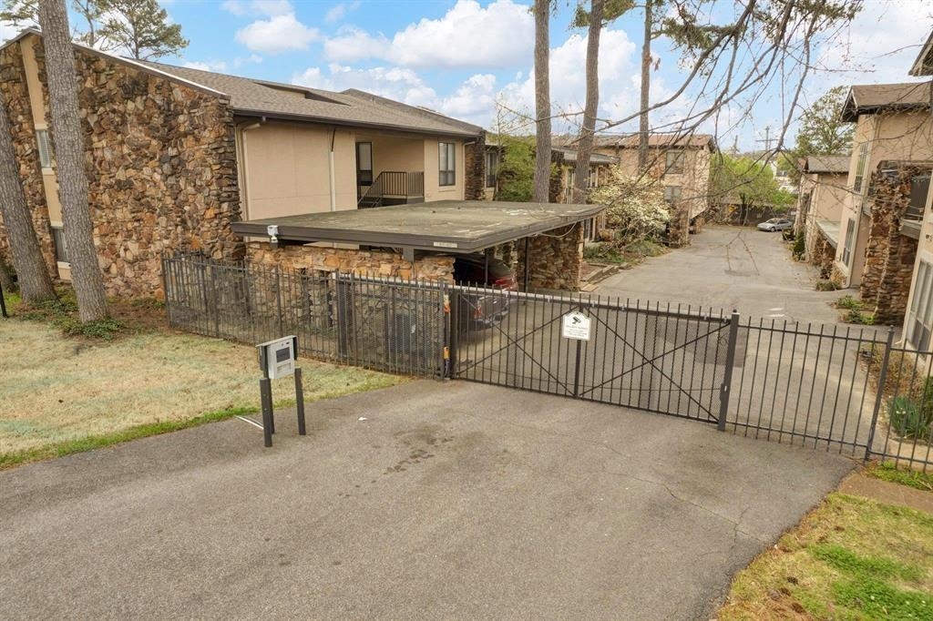 433 South Perkins Road, Unit 433 Memphis, TN 38117 - Photo 2 of 21 a view of a house with a wooden fence