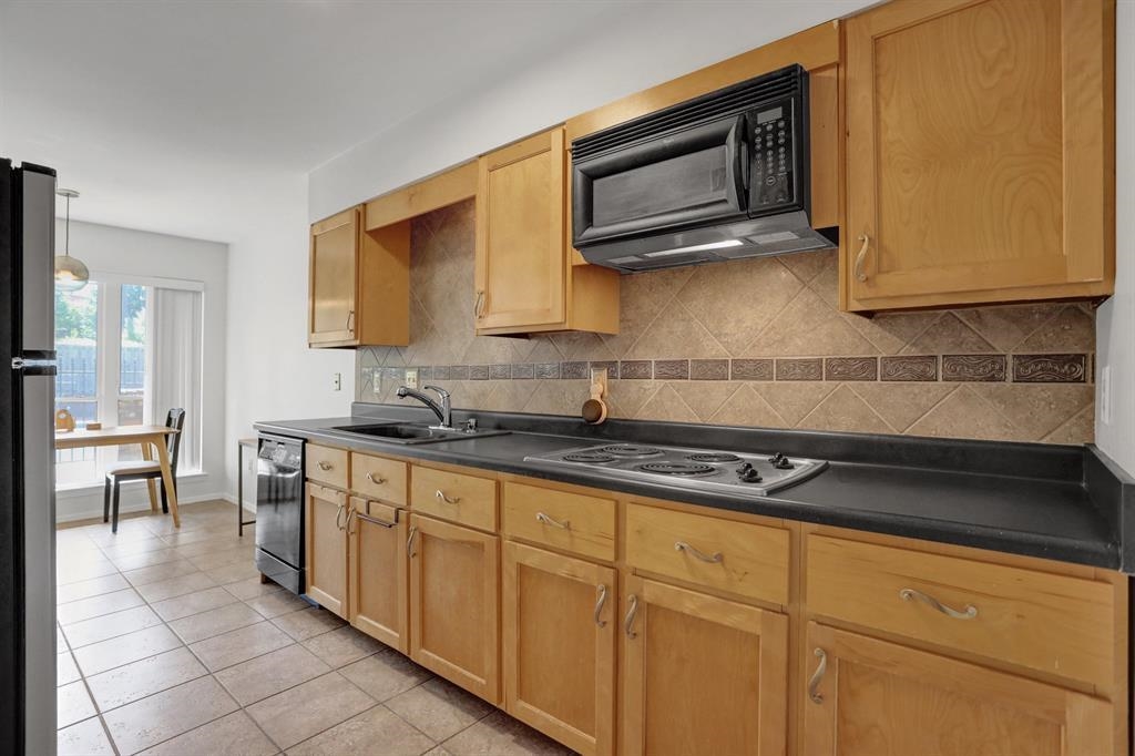433 South Perkins Road, Unit 433 Memphis, TN 38117 - Photo 6 of 21 a kitchen with granite countertop cabinets stainless steel appliances and a counter space