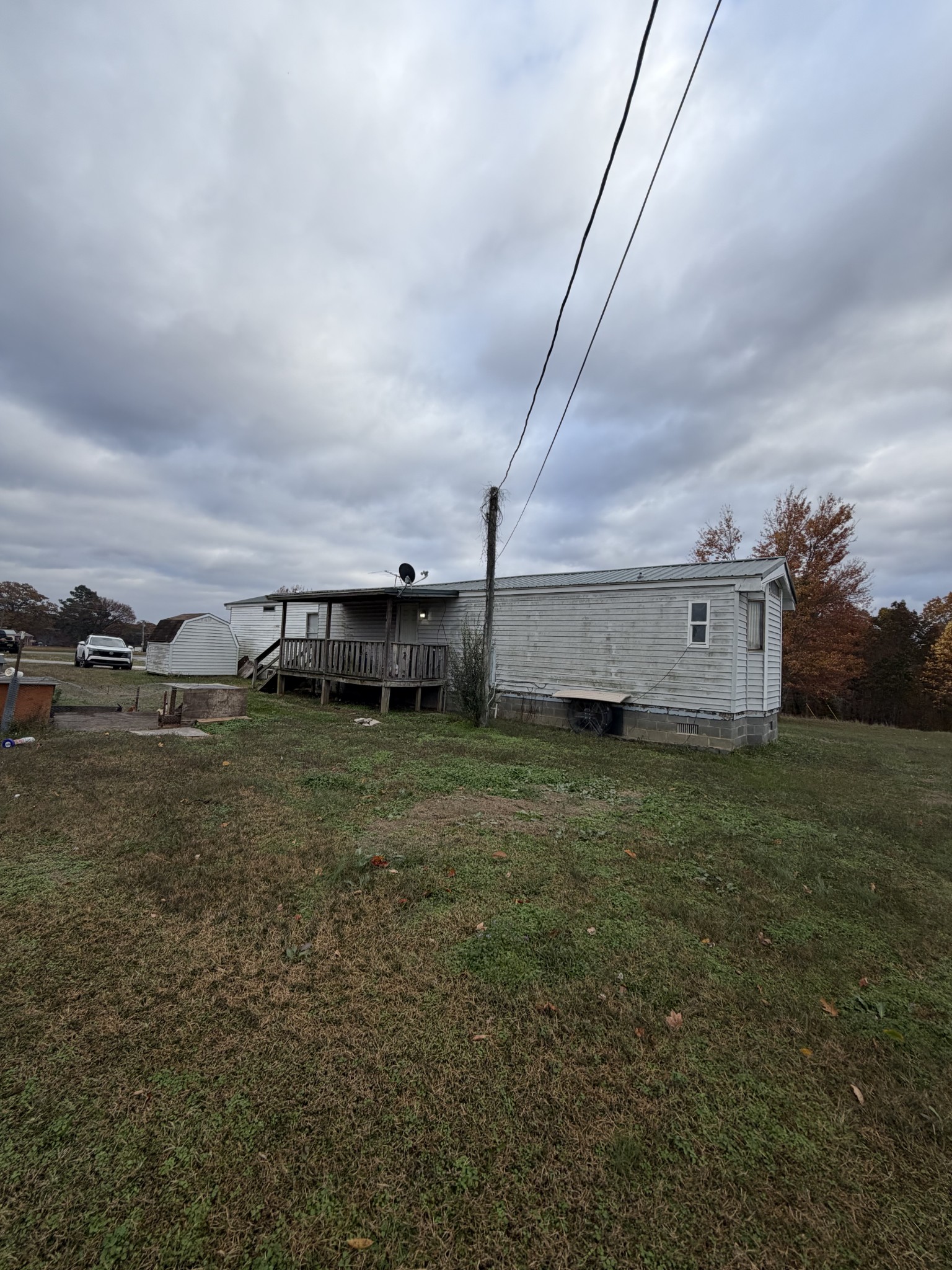 104 Mutt Road White Bluff, TN 37187 - Photo 2 of 3 a view of a big house with a big yard and large trees