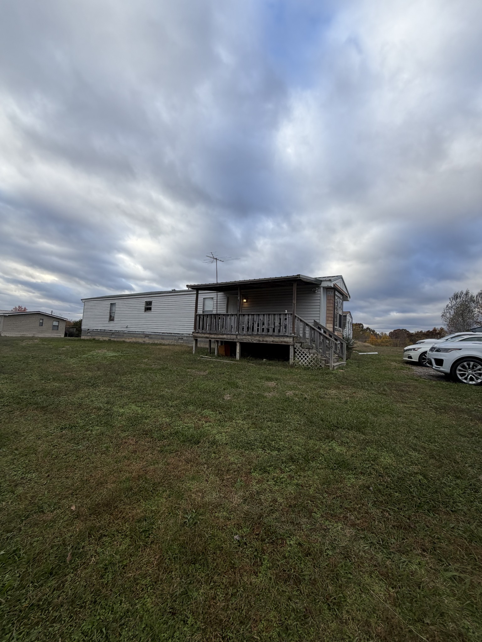104 Mutt Road White Bluff, TN 37187 - Photo 3 of 3 a view of a big house with a big yard and a large trees with wooden fence