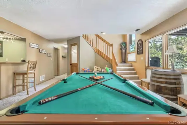 a room with stairs and a wooden floor