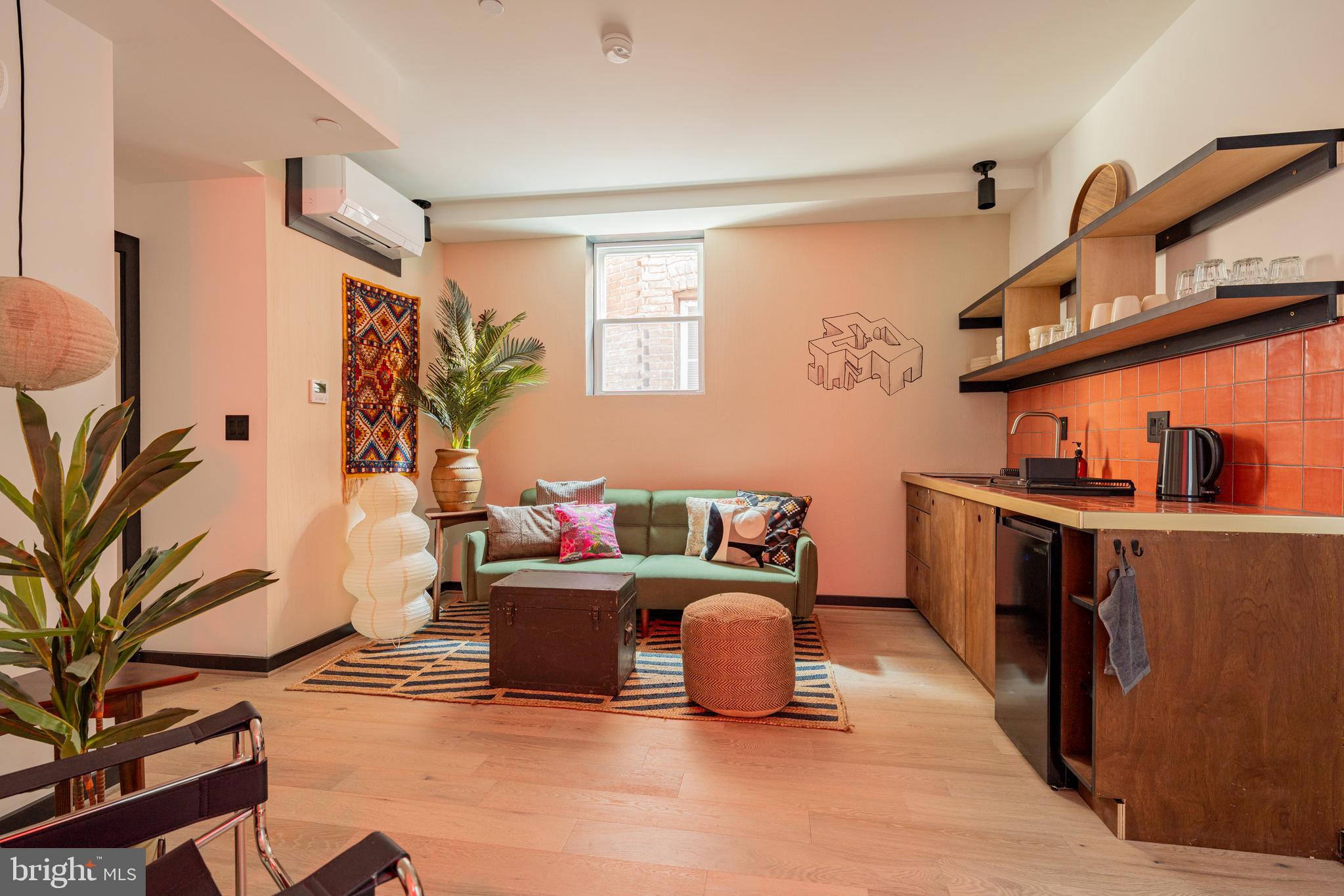 1480 Chapin Street Northwest, Unit 4 1 Washington, DC 20009 - Photo 1 of 23 a living room with furniture and a flat screen tv