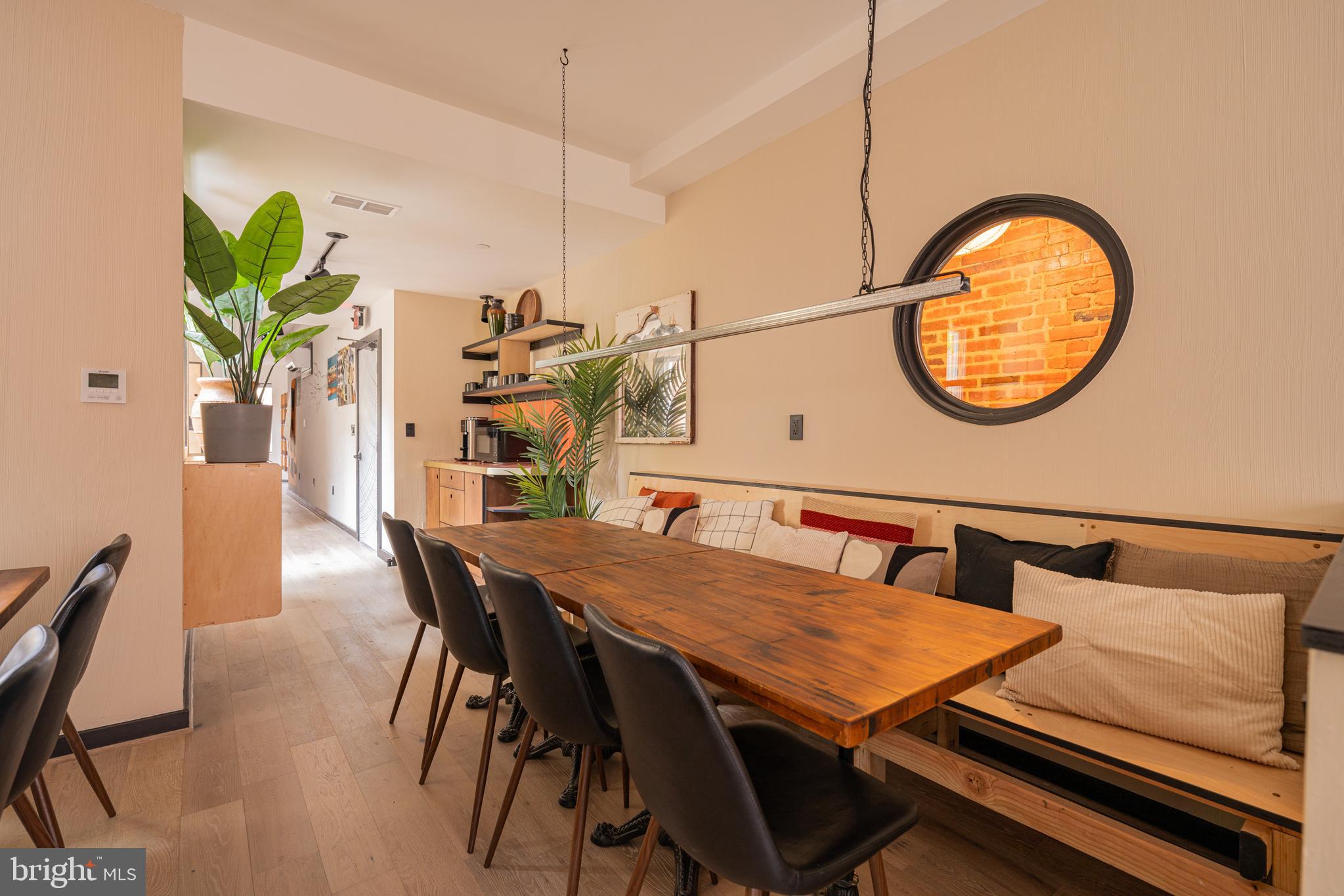 1480 Chapin Street Northwest, Unit 4 1 Washington, DC 20009 - Photo 2 of 23 a dining room with furniture and wooden floor