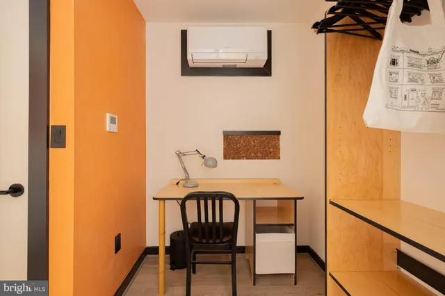 a balcony with table and chairs