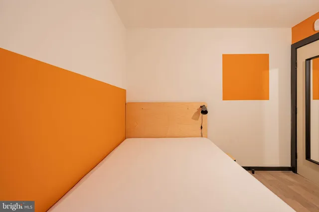 a view of a big room with windows