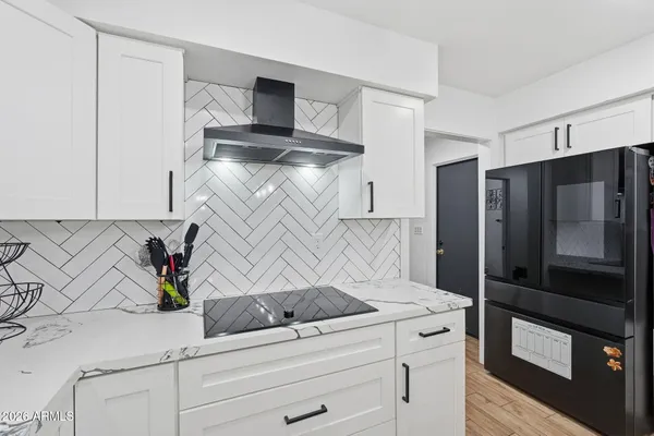 a bed room with a bed and a chair