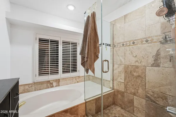 a view of a hallway with entryway and chandelier