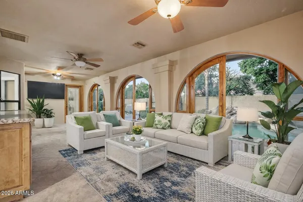 a view of a dinning table and chairs in the patio