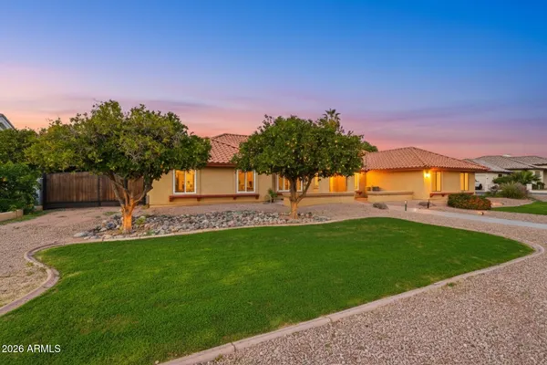 a view of a garden with a house