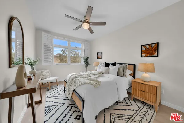 a bedroom with a bed and a table