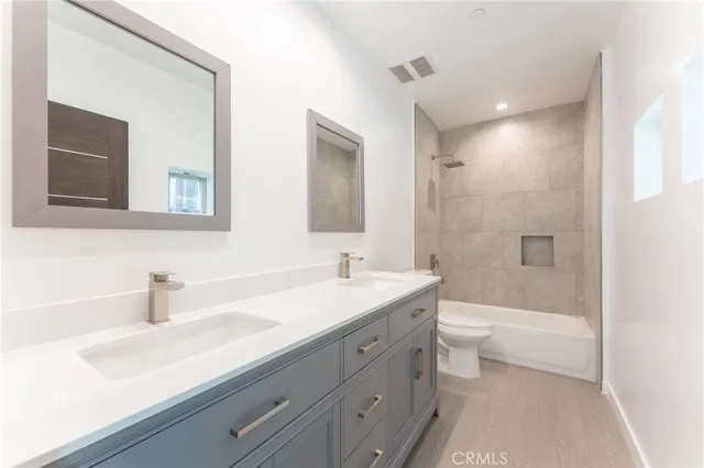 a bathroom with a sink a toilet and a bathtub