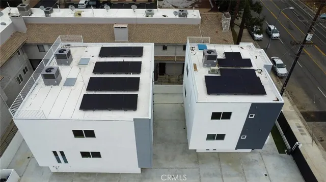 an aerial view of a large white building