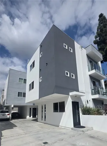 a front view of a building with many windows