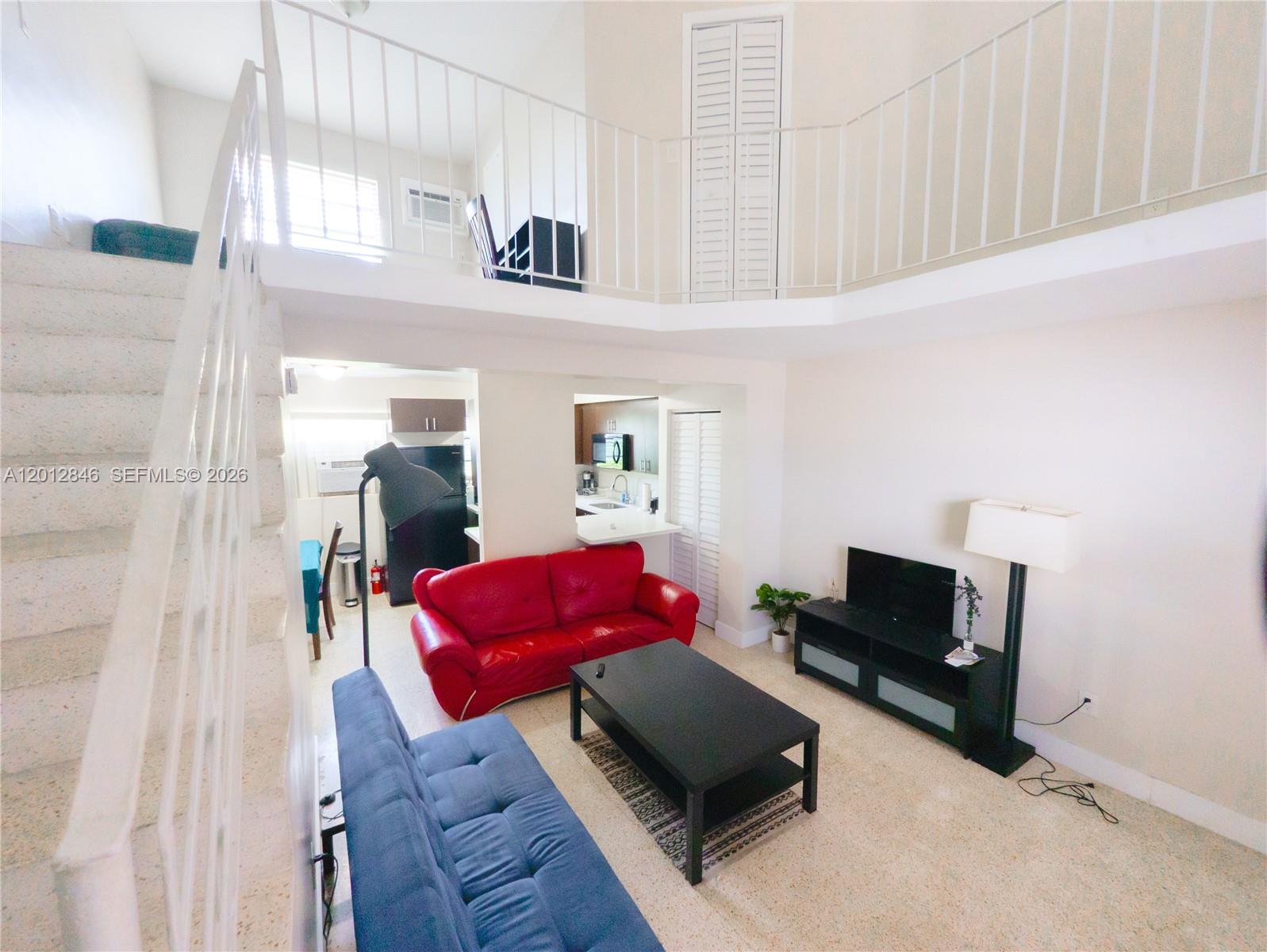 1220 Southwest 5th Street, Unit 16 Miami, FL 33135 - Photo 1 of 8 a living room with furniture and a couch