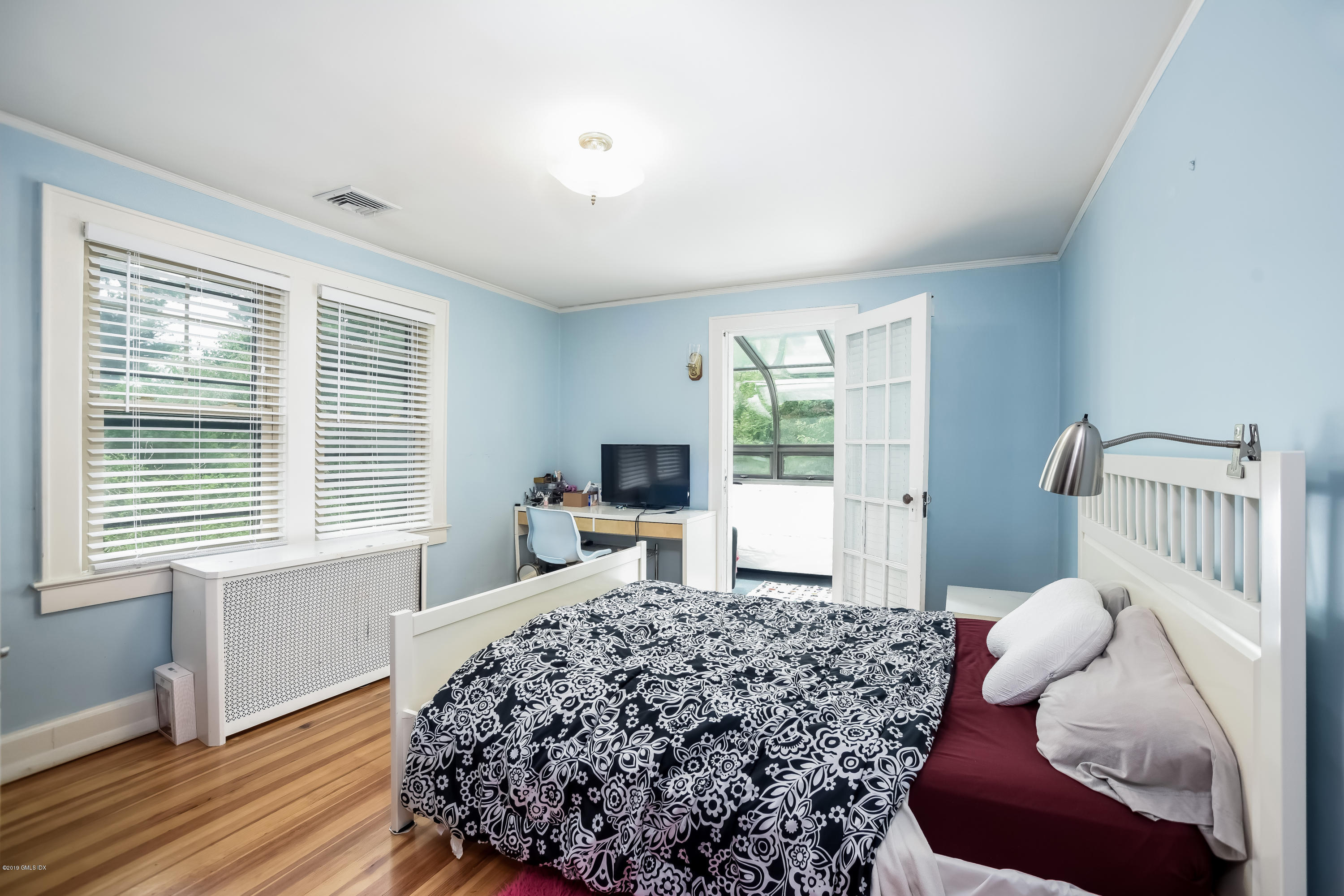 12 Old Post Road Cos Cob, CT 06830 - Photo 17 of 34 a bedroom with a large bed and a window