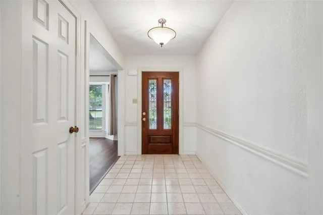 a view of an entryway with wooden floor