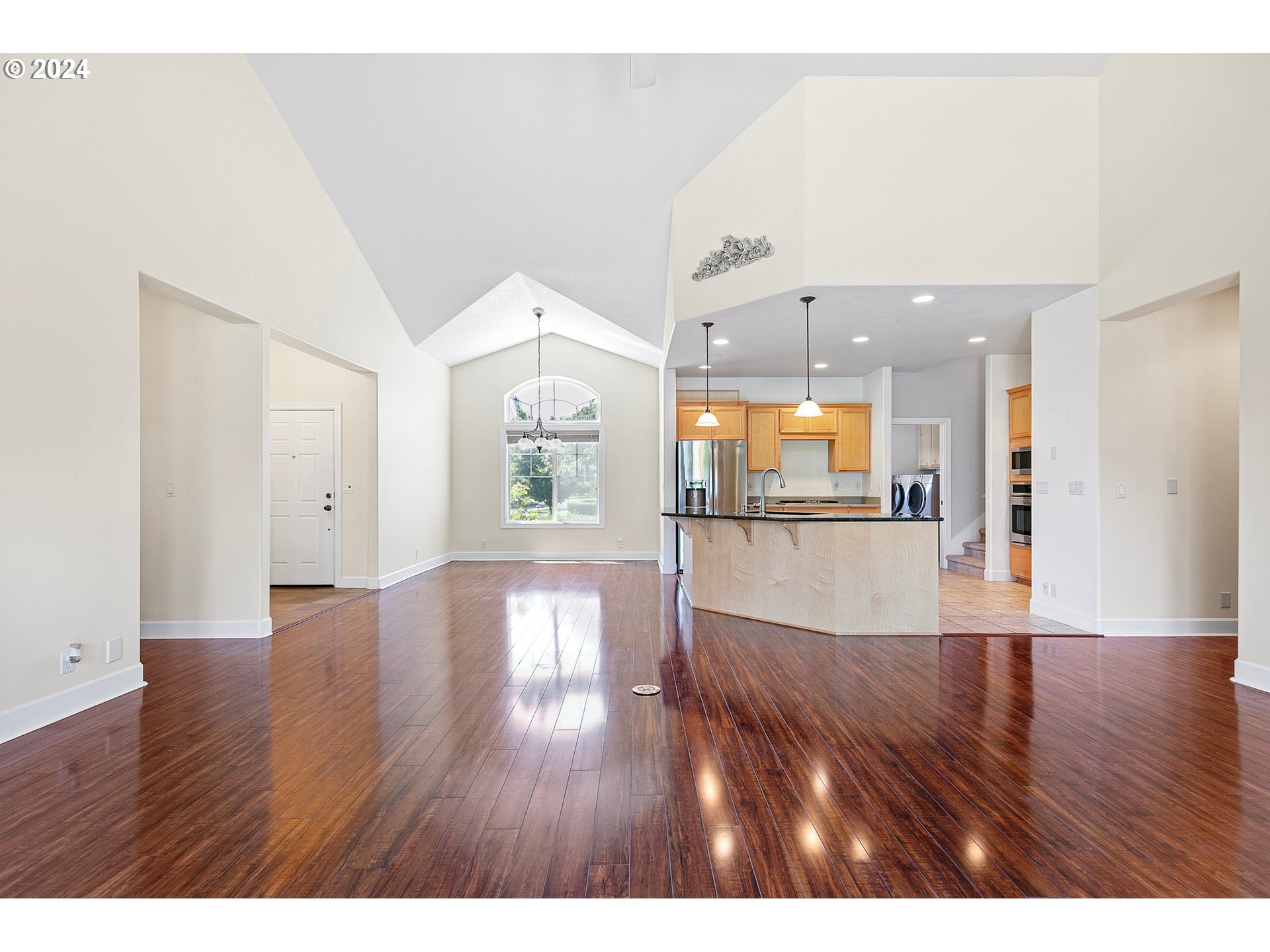 790 Old Orchard Lane Springfield, OR 97477 - Photo 11 of 46 a view of an empty room with wooden floor and a window