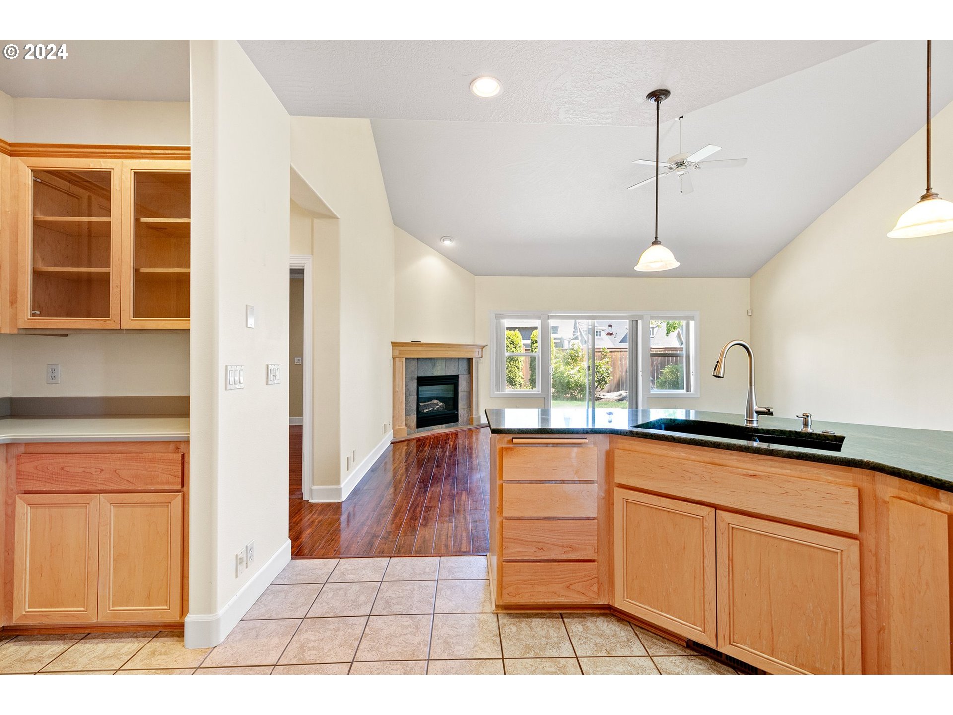 790 Old Orchard Lane Springfield, OR 97477 - Photo 13 of 46 a kitchen with granite countertop a stove a sink and dishwasher with granite countertop cabinets