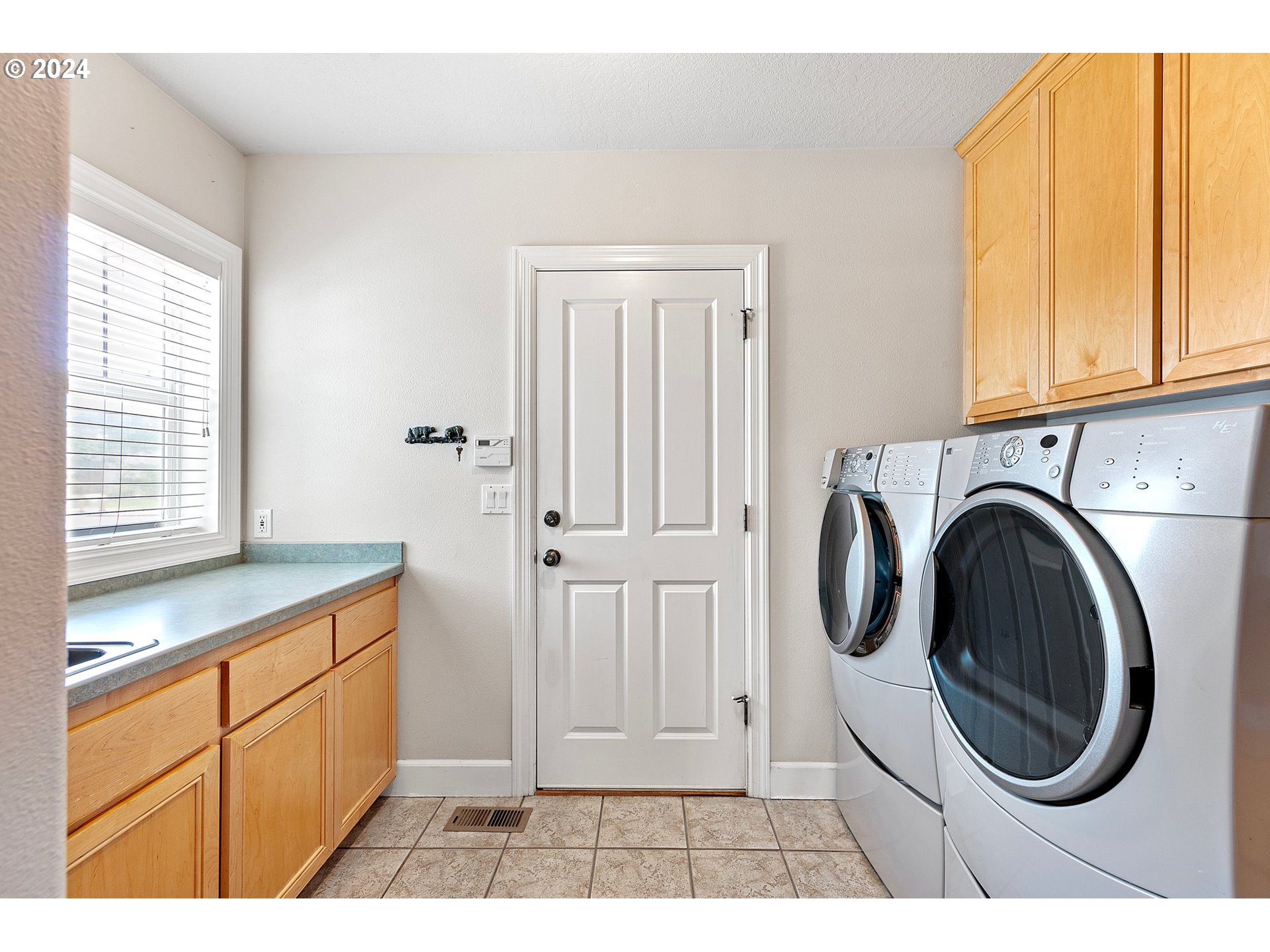 790 Old Orchard Lane Springfield, OR 97477 - Photo 20 of 46 a view of a kitchen with cabinets and a window