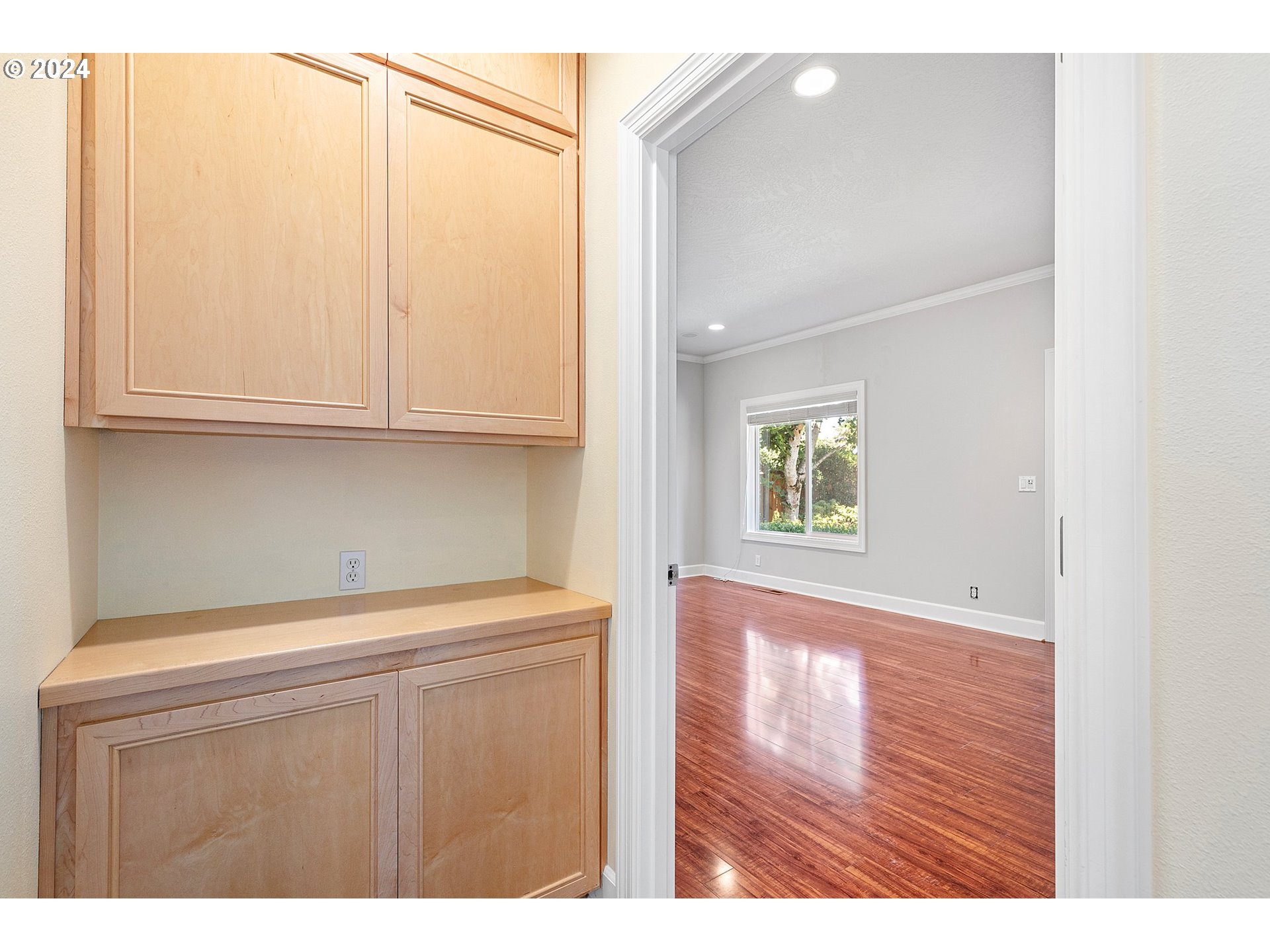 790 Old Orchard Lane Springfield, OR 97477 - Photo 28 of 46 a view of an empty room with wooden floor and cabinets