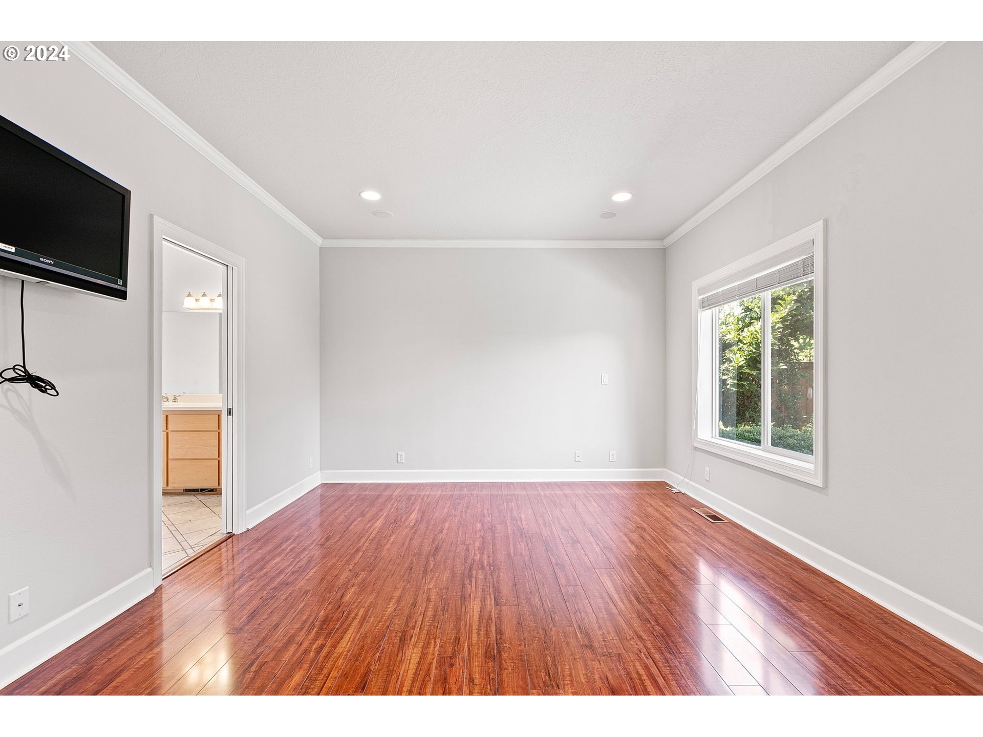 790 Old Orchard Lane Springfield, OR 97477 - Photo 30 of 46 a view of an empty room with a window and wooden floor