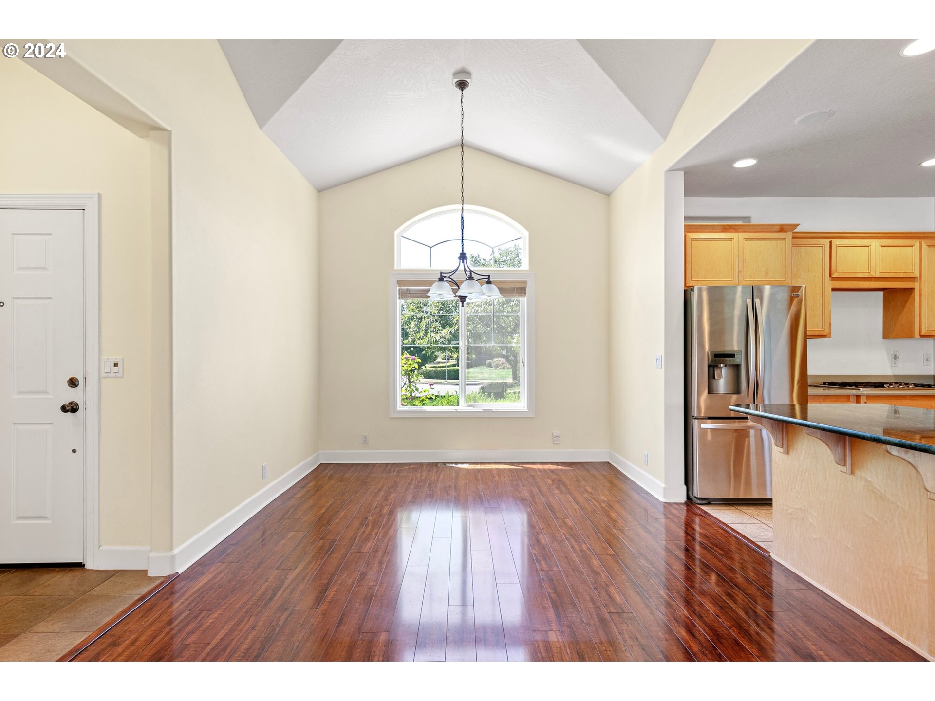 790 Old Orchard Lane Springfield, OR 97477 - Photo 7 of 46 a view of an empty room with window and wooden floor