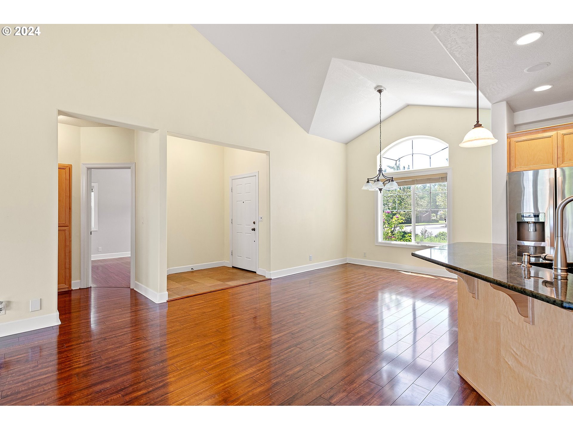 790 Old Orchard Lane Springfield, OR 97477 - Photo 8 of 46 a view of an empty room with window and wooden floor