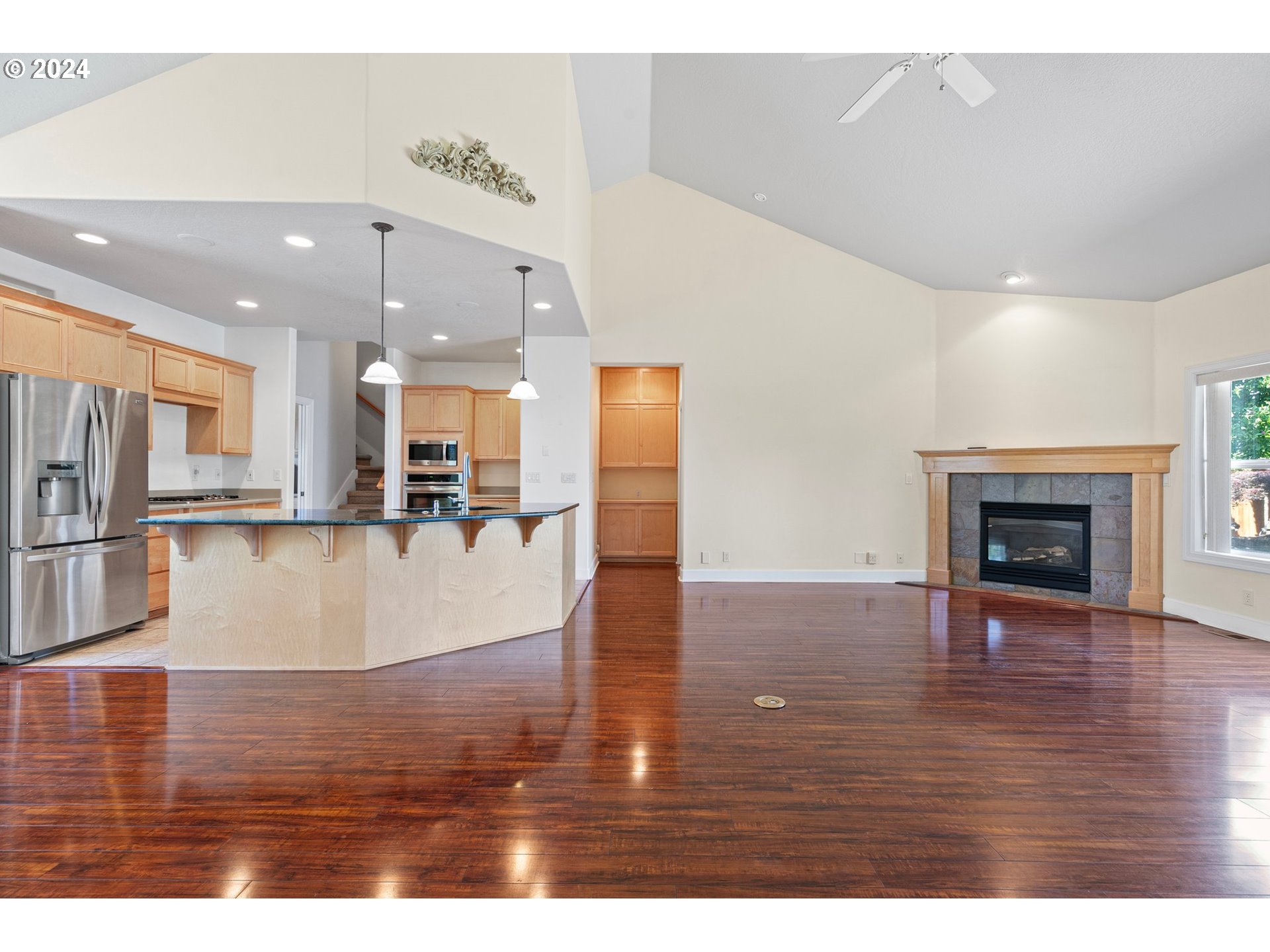 790 Old Orchard Lane Springfield, OR 97477 - Photo 10 of 46 a view of a living room and kitchen with stainless steel appliances