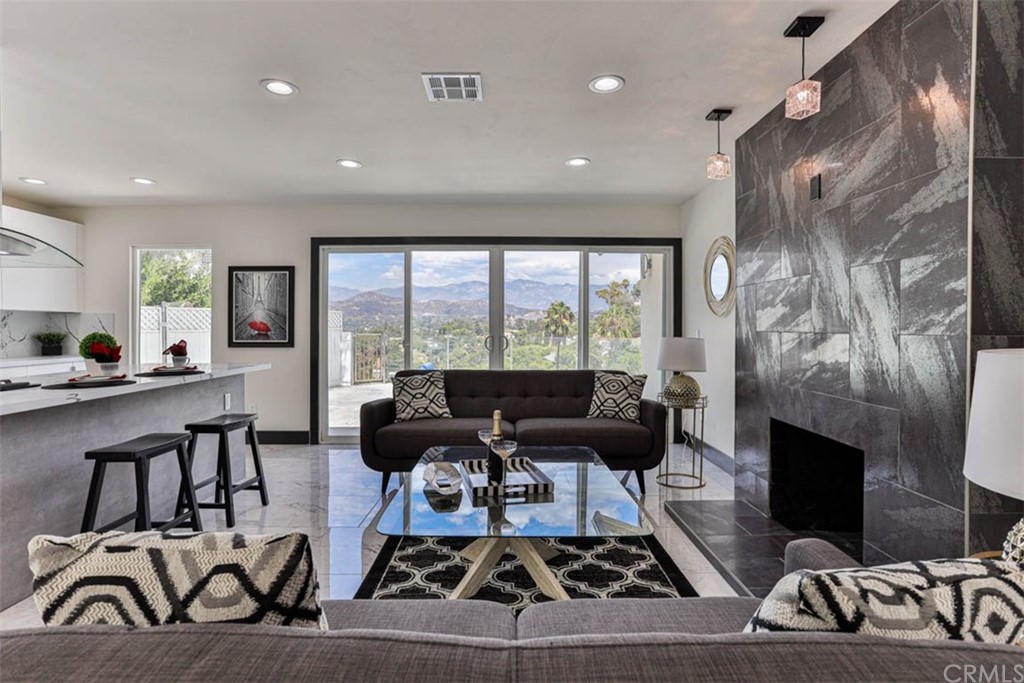 945 Oban Drive Los Angeles, CA 90065 - Photo 1 of 60 a living room with furniture and a fireplace
