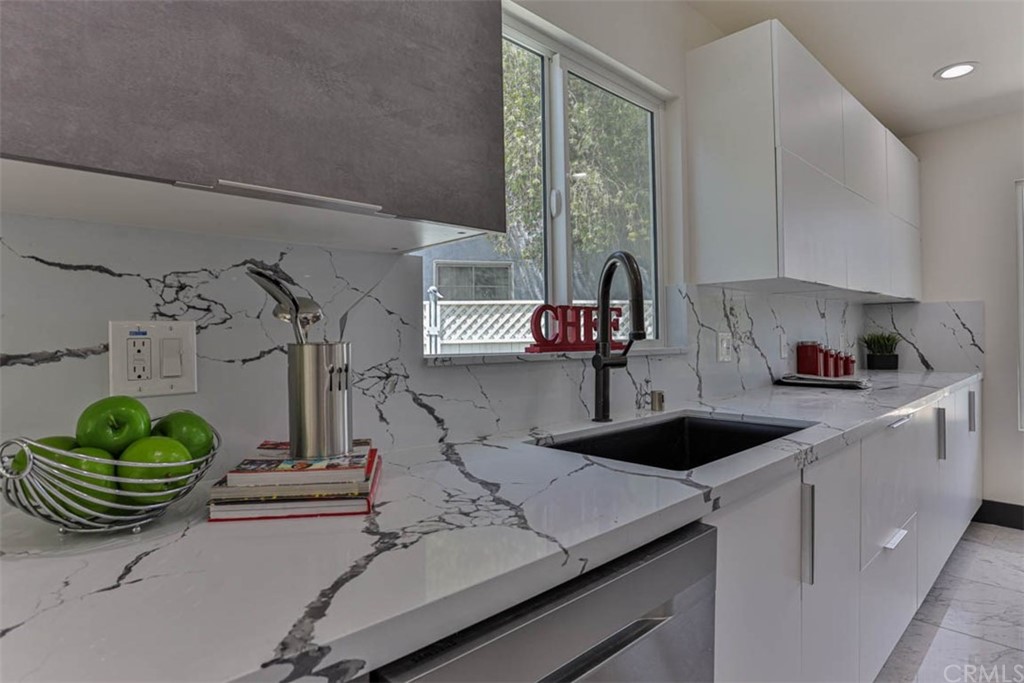 945 Oban Drive Los Angeles, CA 90065 - Photo 14 of 60 a kitchen with a sink and cabinets