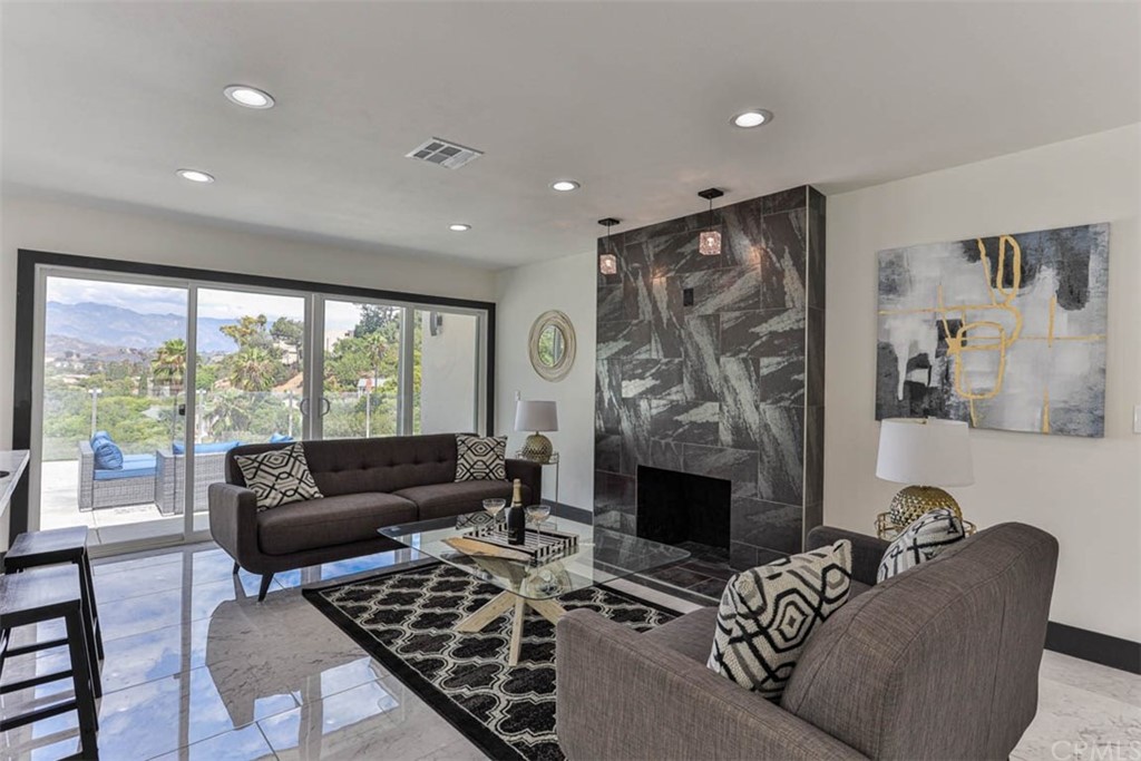 945 Oban Drive Los Angeles, CA 90065 - Photo 17 of 60 a living room with furniture and a fireplace