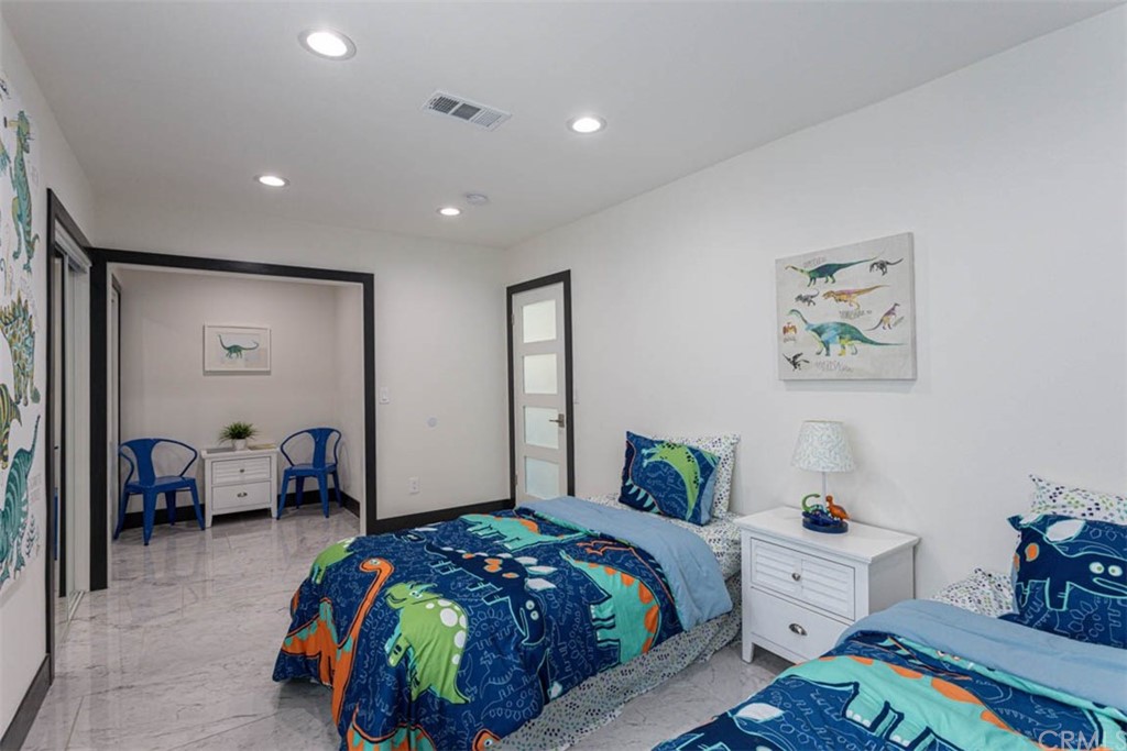 945 Oban Drive Los Angeles, CA 90065 - Photo 37 of 60 a bedroom with a bed and a view of bedroom