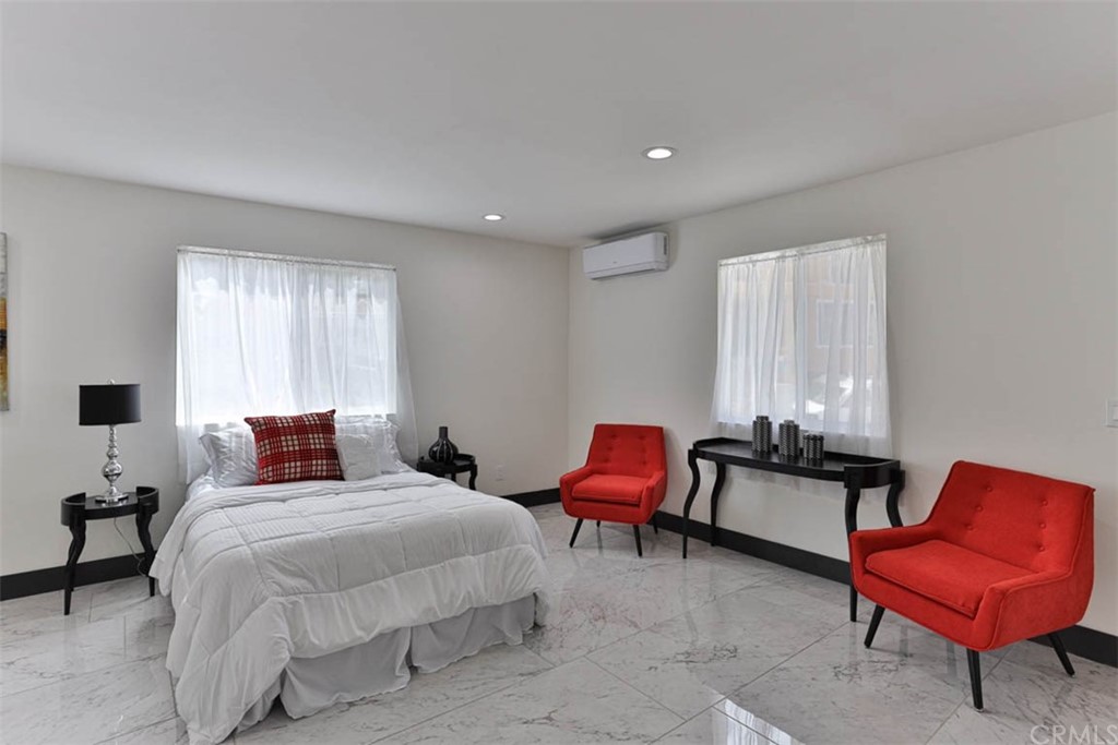 945 Oban Drive Los Angeles, CA 90065 - Photo 43 of 60 a bedroom with a bed and a chair