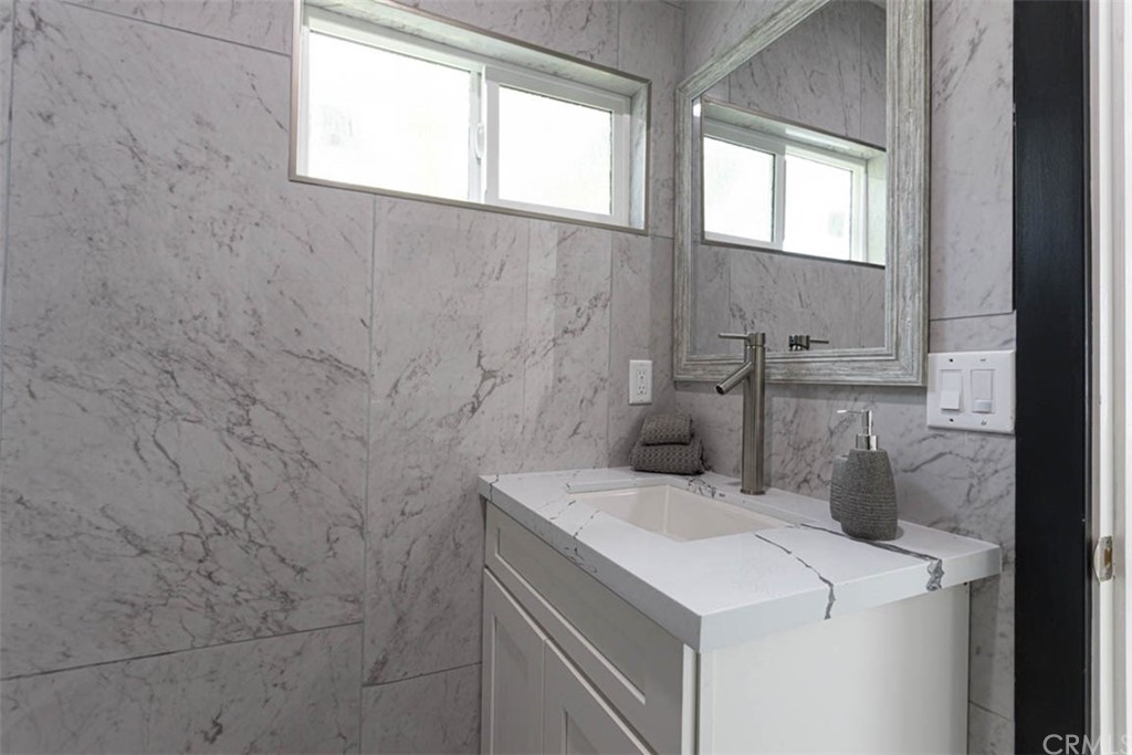 945 Oban Drive Los Angeles, CA 90065 - Photo 47 of 60 a utility room with a sink dryer and washer