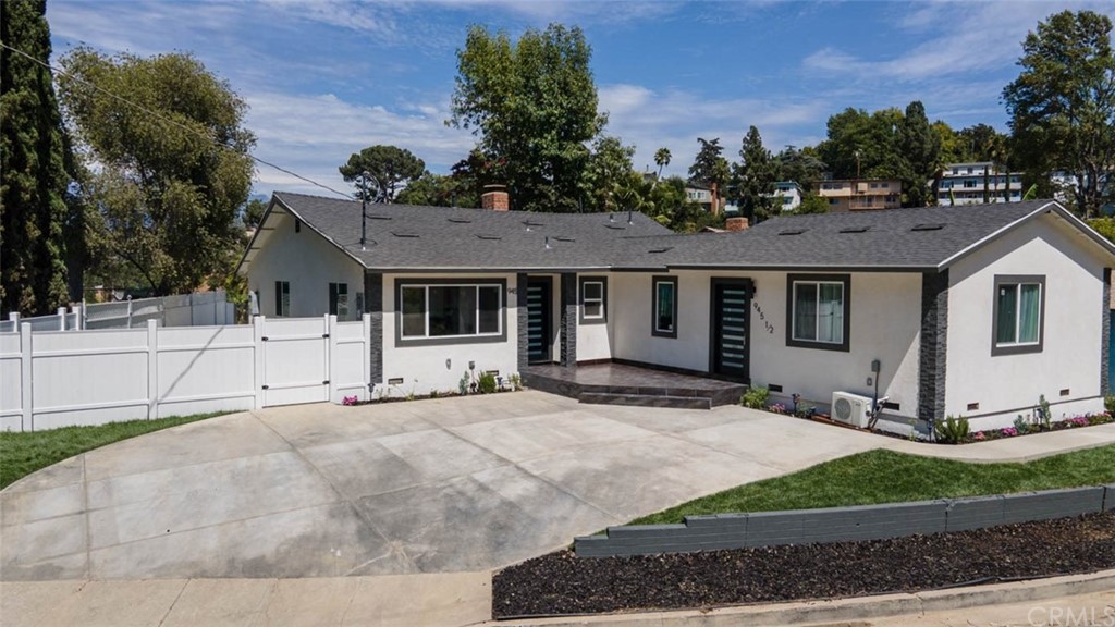 945 Oban Drive Los Angeles, CA 90065 - Photo 55 of 60 a front view of a house with a garden and trees