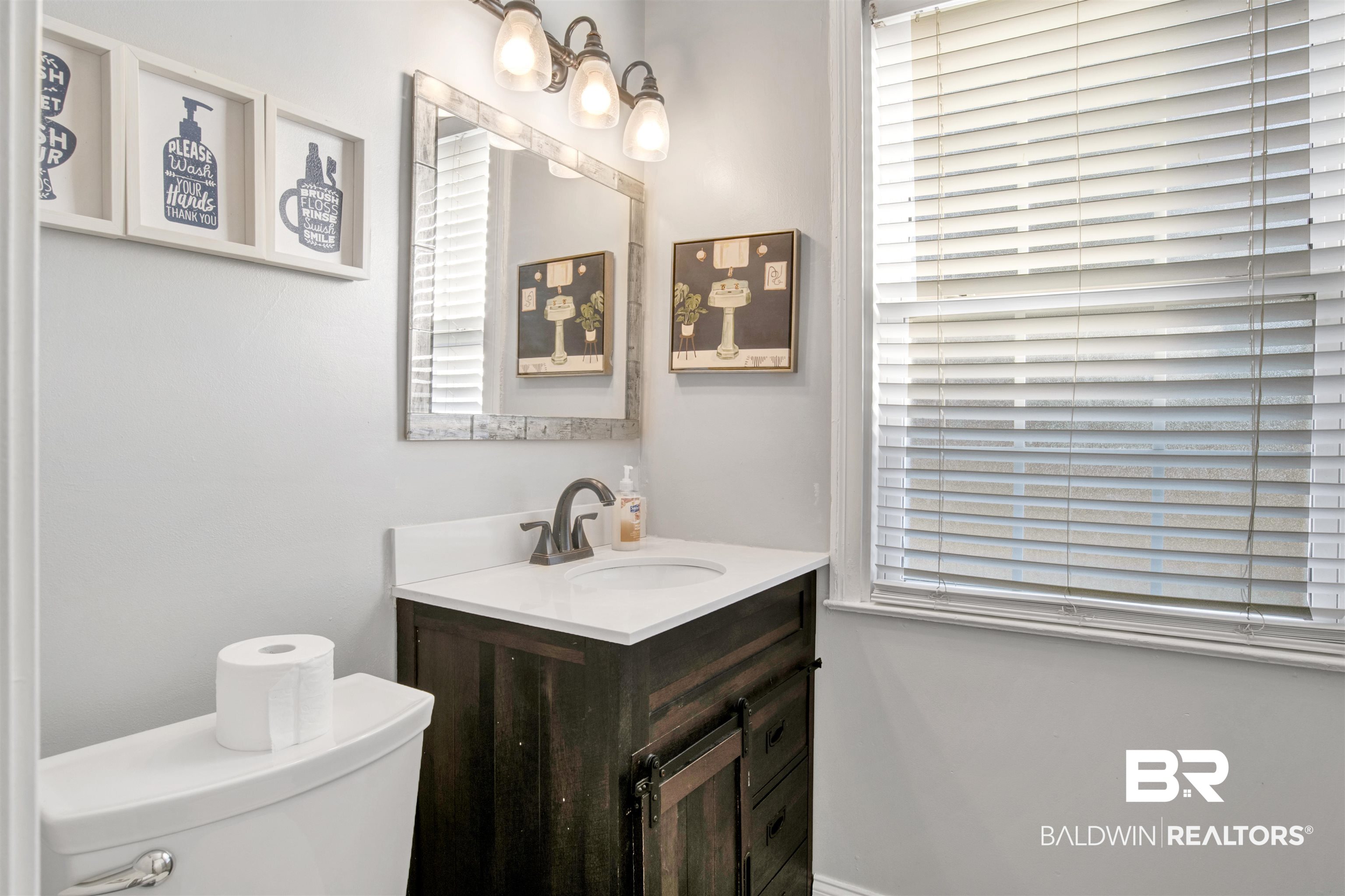 214 Upham Street, Unit 7A Mobile, AL 36607 - Photo 18 of 35 Half bath featuring vanity and toilet