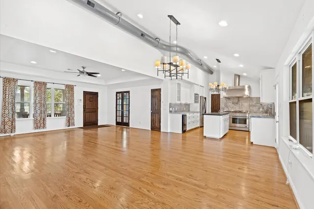a view of kitchen with furniture and wooden floor