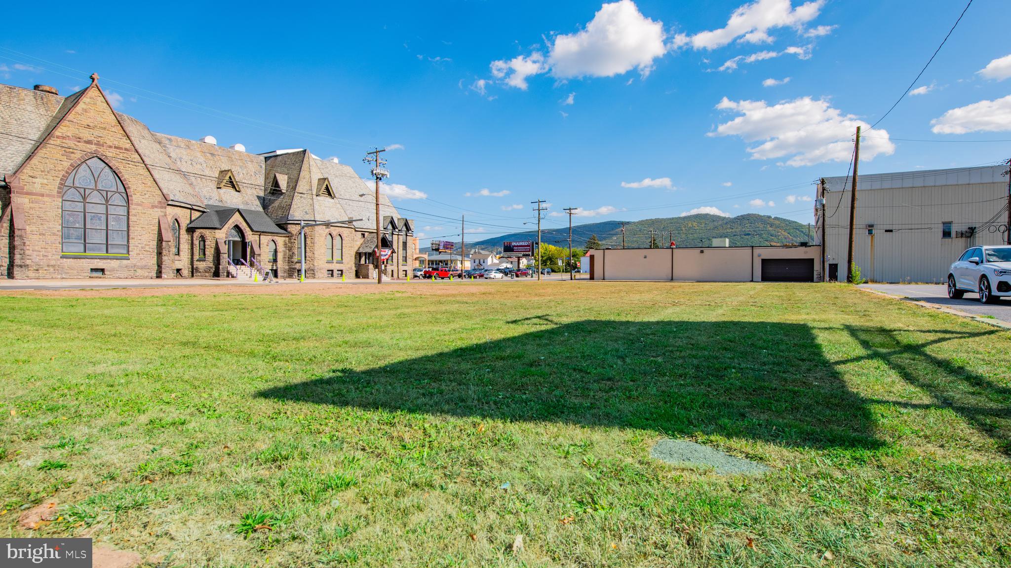 52 East 3rd Street Williamsport, PA 17701 - Photo 4 of 4 a view of a house with a big yard and a large tree