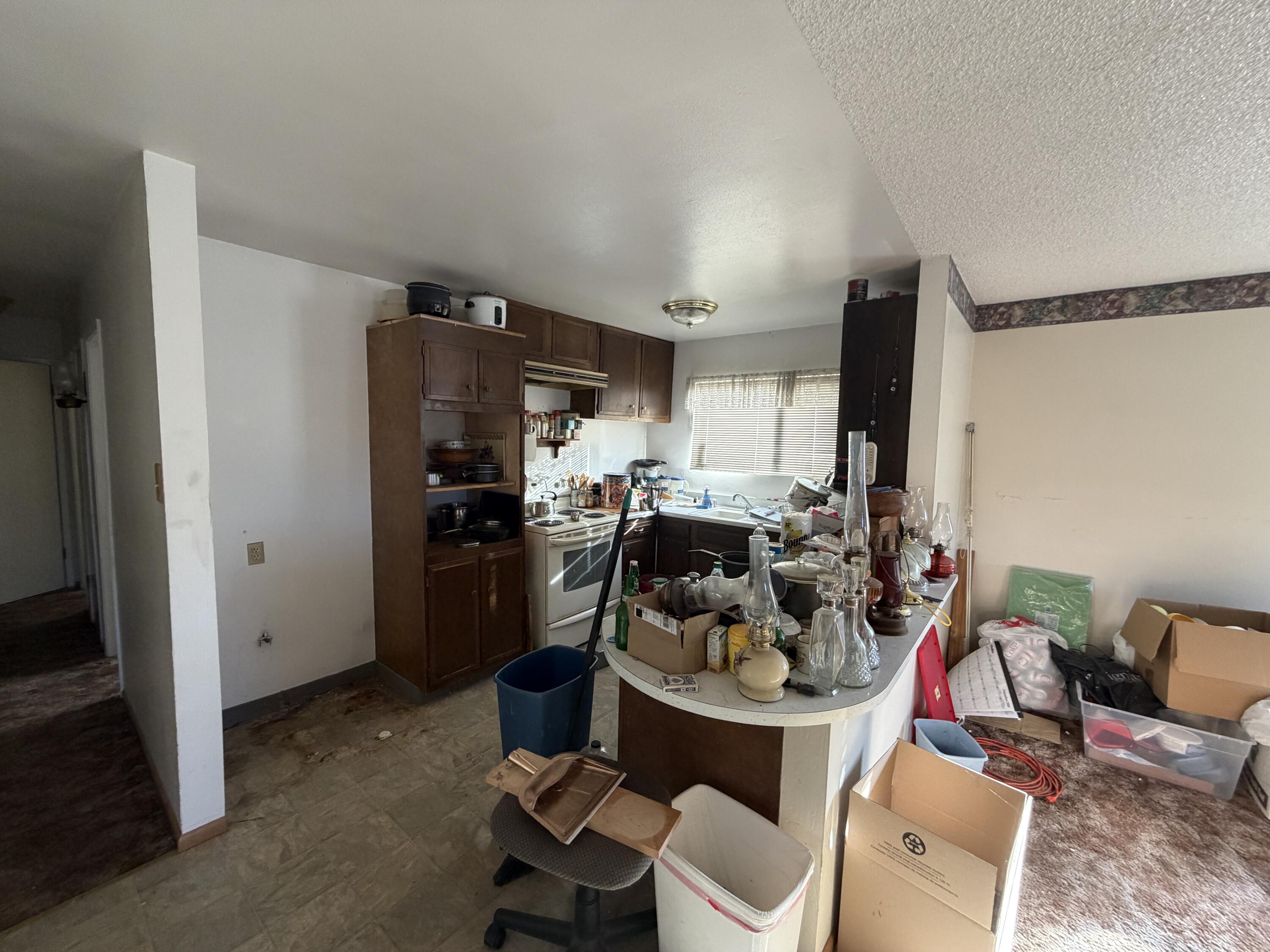 209 2nd Street Bieber, CA 96009 - Photo 4 of 7 a kitchen with a refrigerator and a view of living room