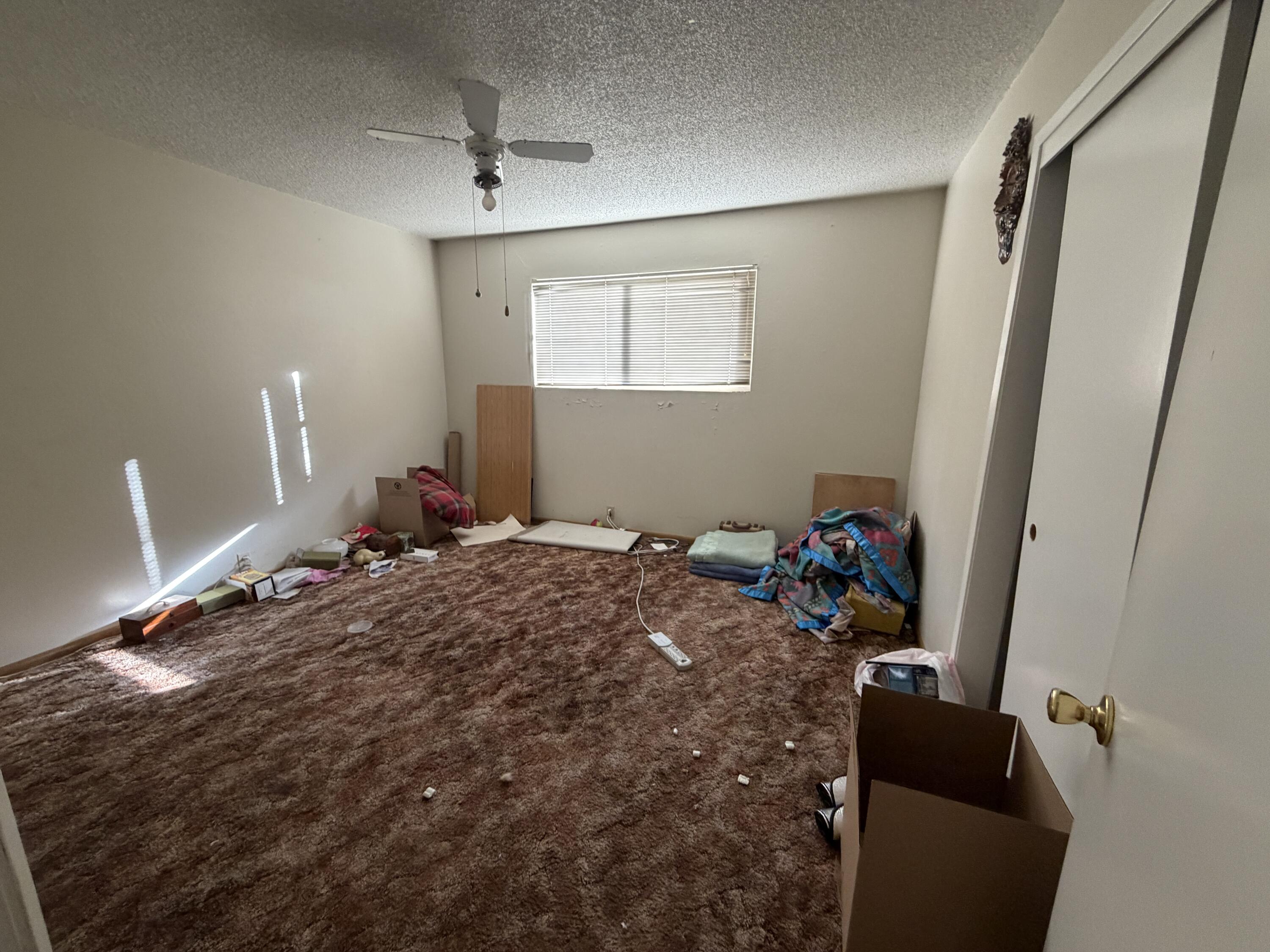 209 2nd Street Bieber, CA 96009 - Photo 5 of 7 a bedroom with a bed and a window