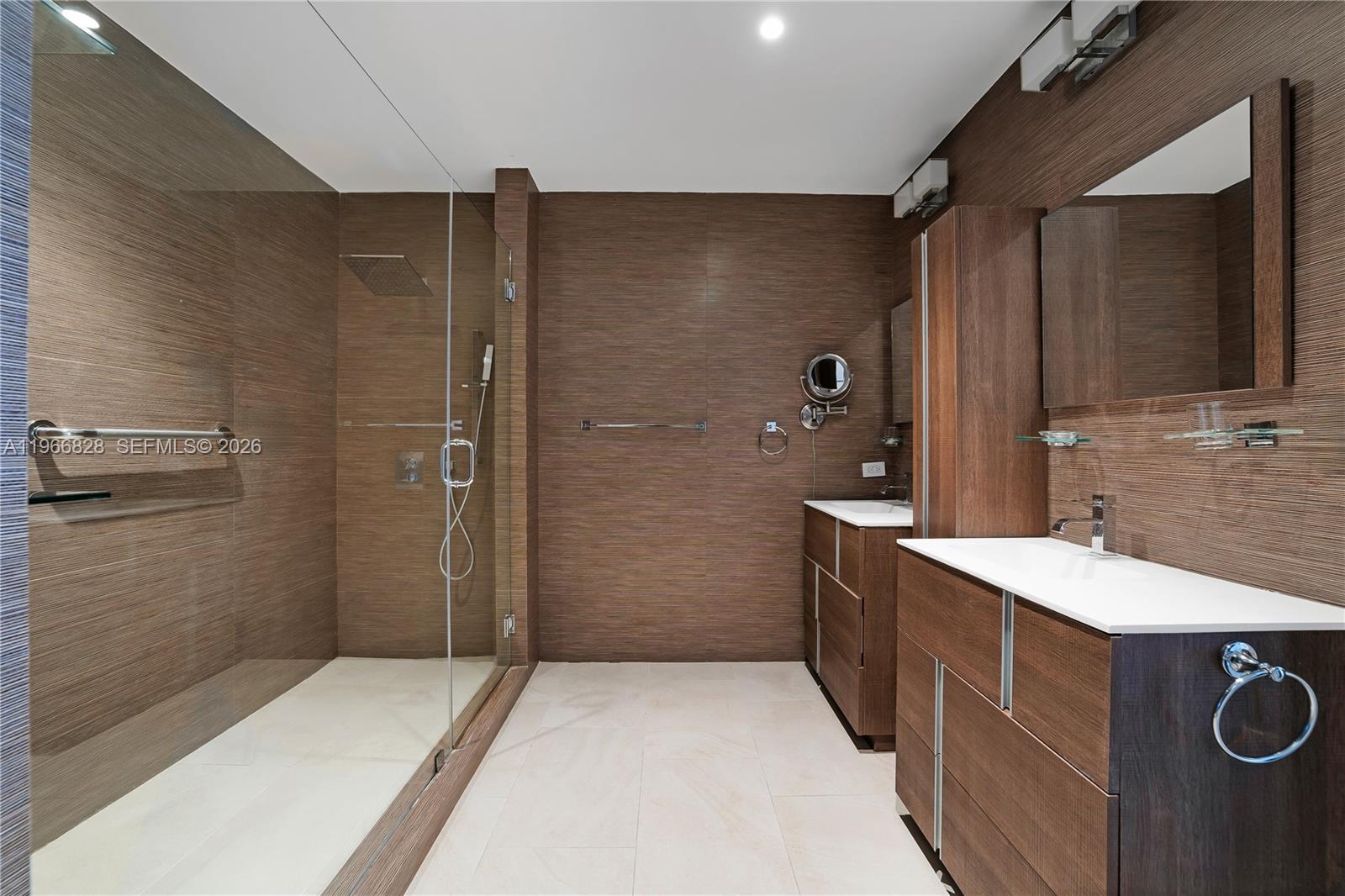 1425 Brickell Avenue, Unit 57A Miami, FL 33131 - Photo 17 of 35 a bathroom with a sink and mirror