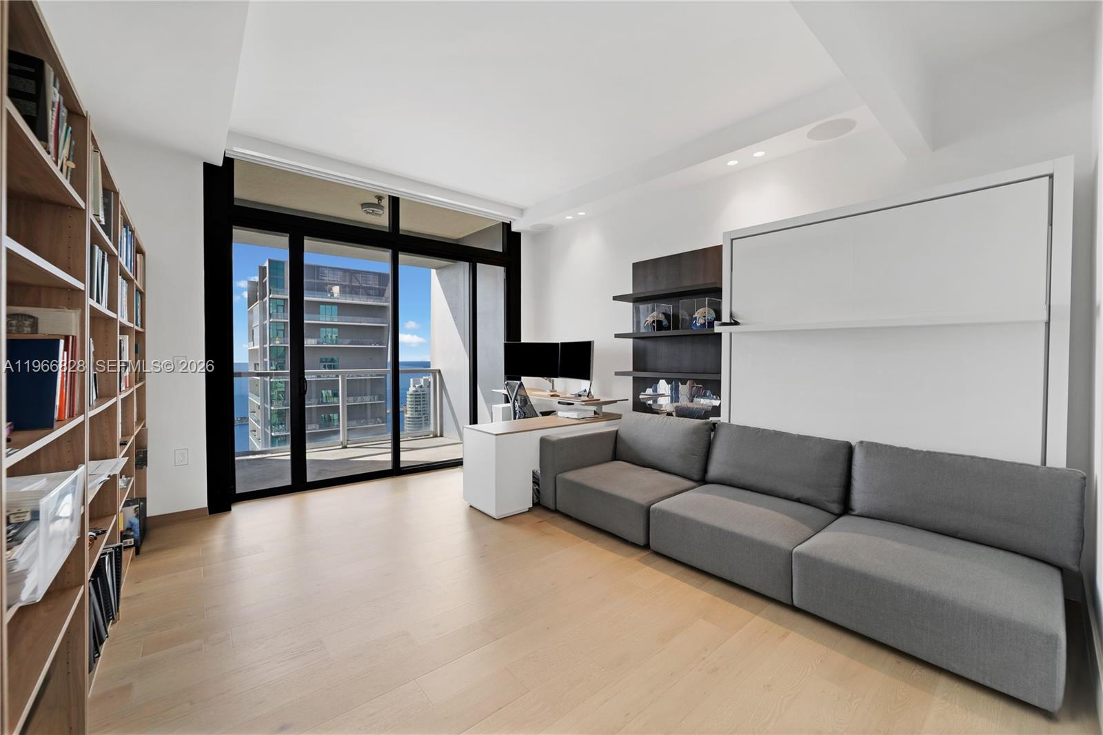 1425 Brickell Avenue, Unit 57A Miami, FL 33131 - Photo 20 of 35 a living room with furniture and a flat screen tv