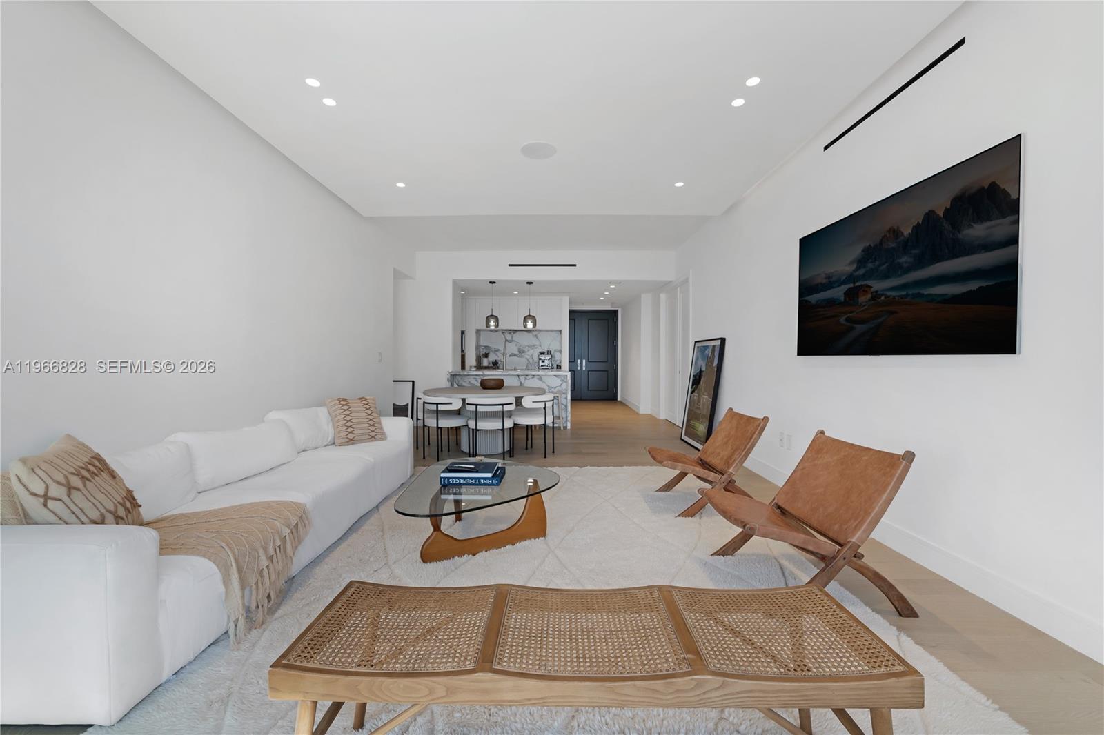 1425 Brickell Avenue, Unit 57A Miami, FL 33131 - Photo 10 of 35 a living room with furniture and a flat screen tv