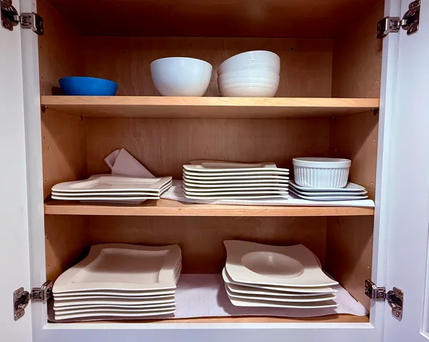 a bathroom with a sink and wooden floor