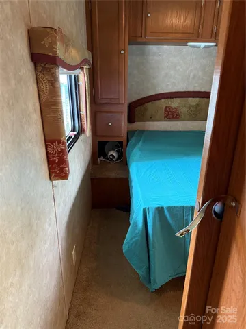 a room with a chair and a large window